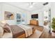 Main bedroom with wood-look tile flooring, a view of the pool and stylish furnishings at 12161 Obelia Ln, Orlando, FL 32827