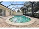 Inviting screened pool with brick pavers surrounding the pool area at 12161 Obelia Ln, Orlando, FL 32827