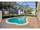 Inviting screened pool with brick pavers surrounding the pool area at 12161 Obelia Ln, Orlando, FL 32827