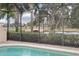 Screened pool area overlooking a picturesque canal and bridge at 12161 Obelia Ln, Orlando, FL 32827