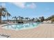 Resort-style pool with ample lounge chairs and lush landscaping at 12161 Obelia Ln, Orlando, FL 32827