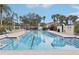 Community pool with lounge chairs and a resort-like atmosphere at 12161 Obelia Ln, Orlando, FL 32827