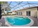 Inviting screened pool with brick pavers and access from the home at 12161 Obelia Ln, Orlando, FL 32827