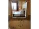 King-size bed with headboard, nightstands, and large window at 12539 Floridays Resort Dr # 210D, Orlando, FL 32821