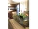 Dining area with glass table, chairs, and kitchen view at 12539 Floridays Resort Dr # 210D, Orlando, FL 32821