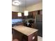 Modern kitchen with island, stainless steel appliances at 12539 Floridays Resort Dr # 210D, Orlando, FL 32821