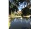 Serene lake view with a fountain, showcasing resort-style living at 12539 Floridays Resort Dr # 210D, Orlando, FL 32821