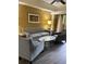 Living Room with gray sofas and chairs, coffee table, and art at 12539 Floridays Resort Dr # 210D, Orlando, FL 32821