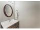 Small bathroom with an oval mirror and vanity at 131 Bristol Forest Trl, Sanford, FL 32771