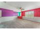 Large bedroom with colorful walls and window at 131 Bristol Forest Trl, Sanford, FL 32771