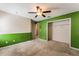 Bedroom with green and white walls and ceiling fan at 131 Bristol Forest Trl, Sanford, FL 32771