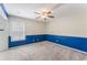 Bedroom with blue walls, ceiling fan and window at 131 Bristol Forest Trl, Sanford, FL 32771