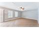 Living room with tile floors, ceiling fan and large windows at 131 Bristol Forest Trl, Sanford, FL 32771