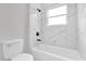 Bathroom with a bathtub and marble tile at 13680 Sw 40Th Avenue Rd, Ocala, FL 34473