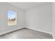 Bright bedroom with large window and grey vinyl flooring at 13680 Sw 40Th Avenue Rd, Ocala, FL 34473