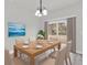 Dining area with light wood table, sliding doors, and neutral decor at 13680 Sw 40Th Avenue Rd, Ocala, FL 34473