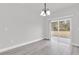 Dining area with wood flooring and sliding glass doors to the backyard at 13680 Sw 40Th Avenue Rd, Ocala, FL 34473