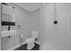 Small bathroom with shower, toilet, sink, and hexagon tile floor at 145 Verbena Dr, Orlando, FL 32807