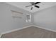 Bedroom with ceiling fan, window, and wood-look tile floor at 145 Verbena Dr, Orlando, FL 32807