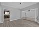 Open dining room with wood-look tile floors and kitchen view at 145 Verbena Dr, Orlando, FL 32807