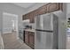 Modern kitchen with dark brown cabinets and stainless steel appliances at 145 Verbena Dr, Orlando, FL 32807