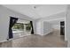 Living room with sliding glass doors opening to a pool and patio at 145 Verbena Dr, Orlando, FL 32807