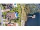 Home boasts a private dock and pool at 15550 Avenue Of The Arbors, Winter Garden, FL 34787