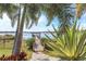 Serene backyard oasis featuring a private dock with gazebo, perfect for enjoying lake views at 15550 Avenue Of The Arbors, Winter Garden, FL 34787