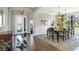 Bright dining room with hardwood floors and modern chandelier at 15550 Avenue Of The Arbors, Winter Garden, FL 34787