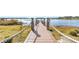 Long wooden dock extending over calm lake water at 15550 Avenue Of The Arbors, Winter Garden, FL 34787