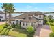 Two-story home with tile roof, stone accents, and landscaping at 15550 Avenue Of The Arbors, Winter Garden, FL 34787