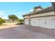 Two-car garage with paver driveway and curb appeal at 15550 Avenue Of The Arbors, Winter Garden, FL 34787