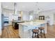 Modern kitchen with large island, stainless steel appliances, and white cabinets at 15550 Avenue Of The Arbors, Winter Garden, FL 34787