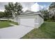 White garage door and concrete driveway at 16391 Sw 17Th Terrace Rd, Ocala, FL 34473