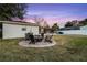 Spacious backyard with fire pit and seating area at 1818 Foxboro Dr, Orlando, FL 32812