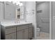 Modern bathroom with gray vanity and marble countertop at 1818 Foxboro Dr, Orlando, FL 32812