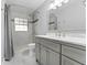 Updated bathroom with gray vanity and marble-look floors at 1818 Foxboro Dr, Orlando, FL 32812