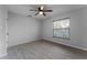 Bright bedroom with wood-look floors and ceiling fan at 1818 Foxboro Dr, Orlando, FL 32812