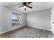 Well-lit bedroom featuring wood-look floors and a ceiling fan at 1818 Foxboro Dr, Orlando, FL 32812