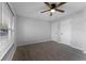 Bright bedroom with wood-look floors and window with blinds at 1818 Foxboro Dr, Orlando, FL 32812