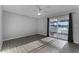 Bedroom with wood-look floors and sliding glass doors at 1818 Foxboro Dr, Orlando, FL 32812