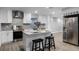 Modern kitchen featuring white shaker cabinets, granite countertops, and stainless steel appliances at 1818 Foxboro Dr, Orlando, FL 32812