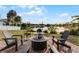 Relaxing patio area with fire pit and lake view at 1818 Foxboro Dr, Orlando, FL 32812