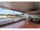 Screened porch overlooking a tranquil lake at 1818 Foxboro Dr, Orlando, FL 32812