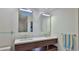 Double vanity bathroom with modern wood cabinets and quartz countertops at 1890 Silver Fern Dr, Port Orange, FL 32128