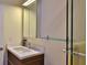 Bathroom with a single vanity, glass shelves, and a large medicine cabinet at 1890 Silver Fern Dr, Port Orange, FL 32128