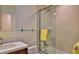 Clean bathroom with shower/tub combo, modern vanity, and glass shelves at 1890 Silver Fern Dr, Port Orange, FL 32128