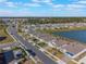 Aerial view of a residential neighborhood featuring houses near a lake at 2025 Havasu Falls Ave, Deland, FL 32724