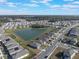 Aerial view of neighborhood with pond at 2025 Havasu Falls Ave, Deland, FL 32724