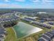 Aerial view of houses and a pond in a new development at 2025 Havasu Falls Ave, Deland, FL 32724